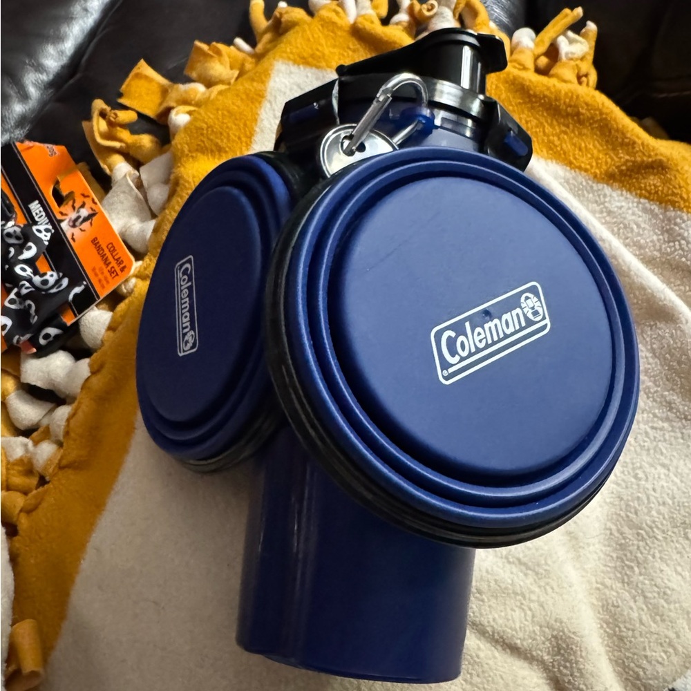 Water/food carrier with bowls .  Never used. Purchased in the summer.